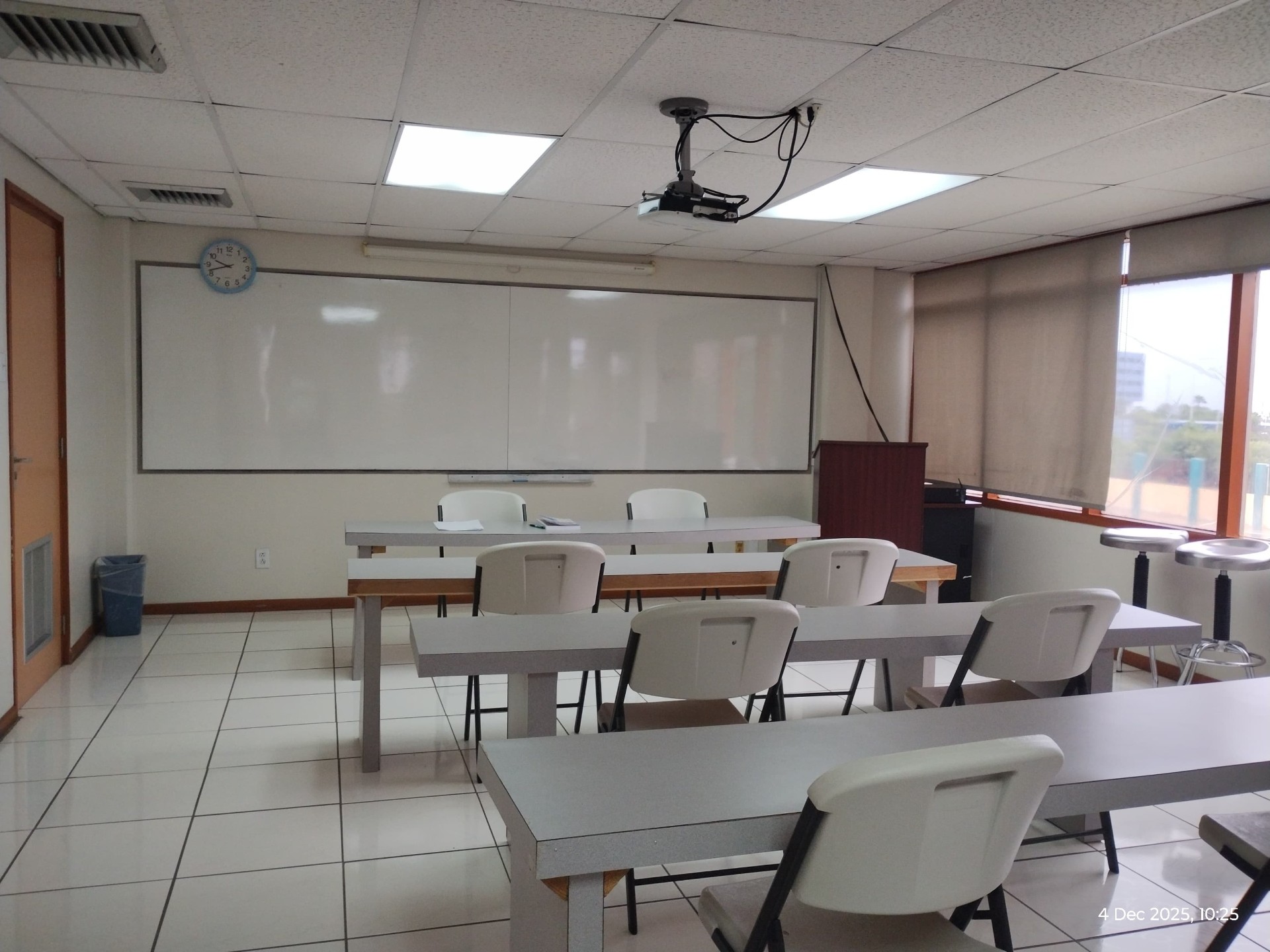 Aureus University classroom with whiteboard and projector