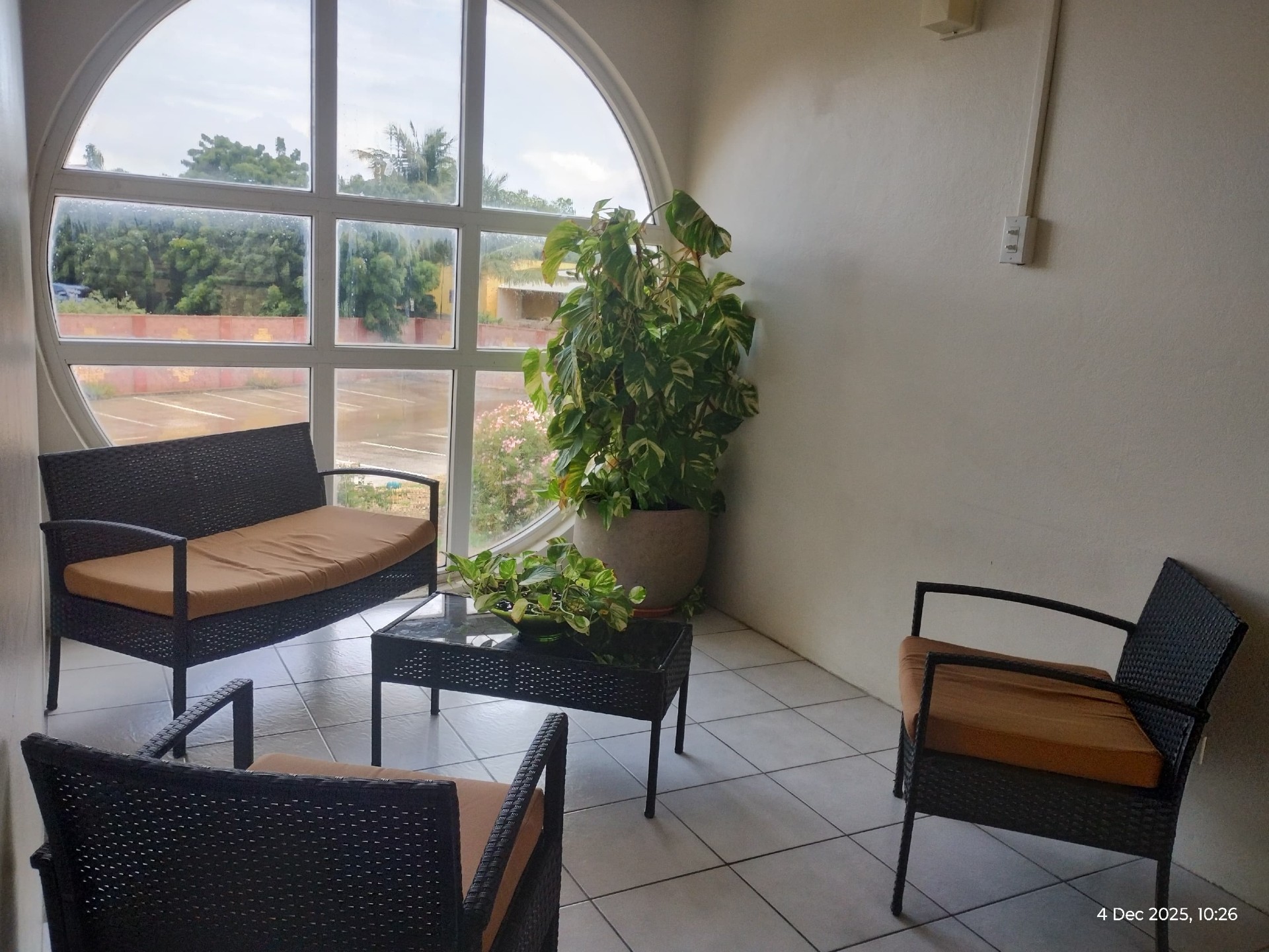 Student lounge with arched window overlooking campus